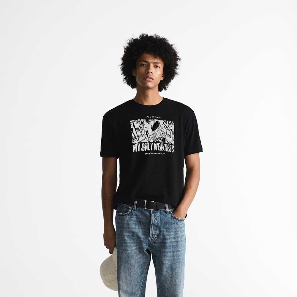 Black Anime T-shirt dedicated to Black Clover series with Yono in chains on it - photo of a model
