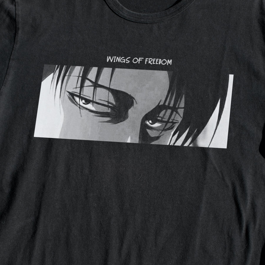 Close up of Attack on Titan black T-shirt with Captain Levi eyes and phrase "wings of freedom".